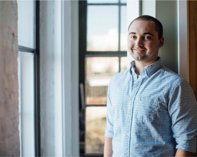 young man near it service provider window