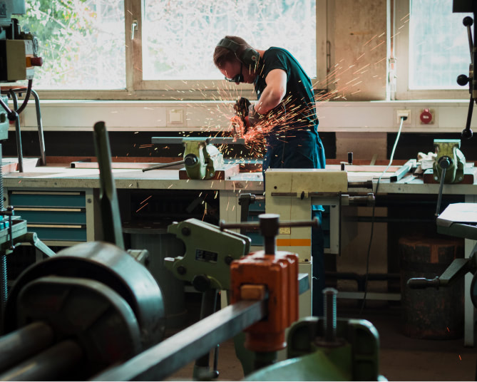 Person using a saw to cut wood